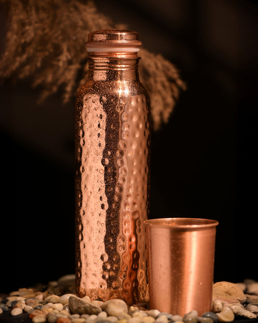 A copper bottle with a copper copper in an artistic background